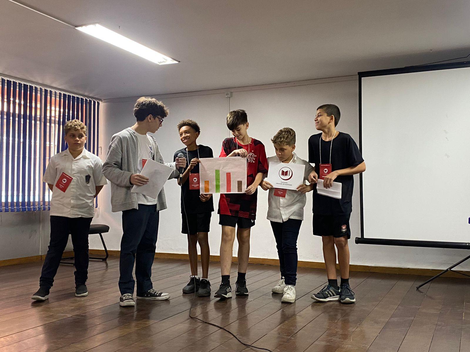 Figure 4: Students presenting the results of their work on a stage.