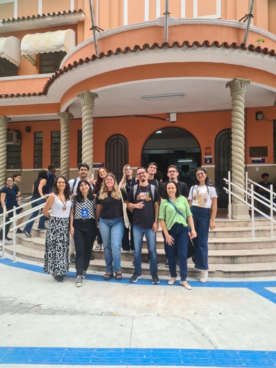 Figure 5: Undergraduates and 2 of the 3 advisors of the project in front of the school (where the project was implemented) entrance.